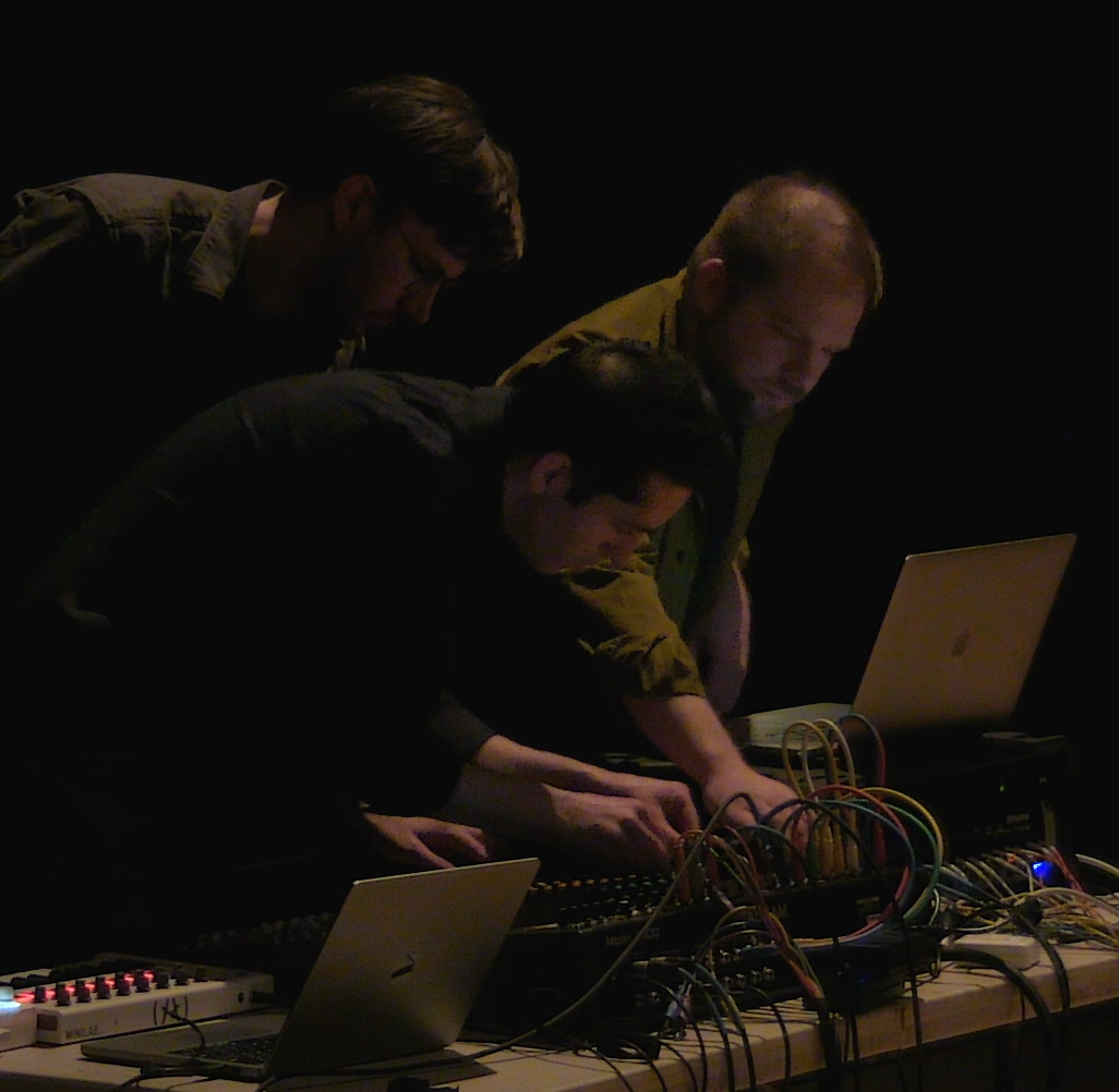 Performers at electronics table